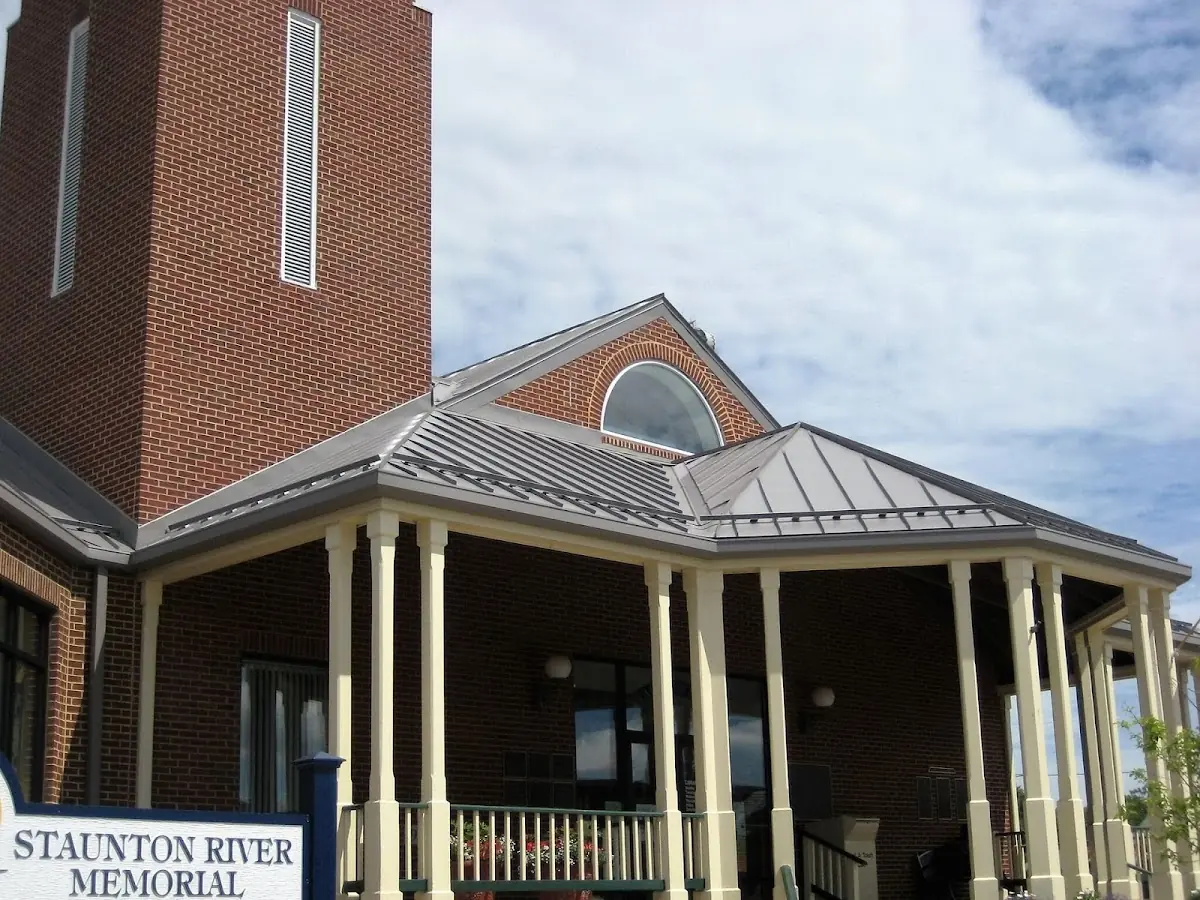 Skilled roofing craftsmen working on a residential roof in Town and Country